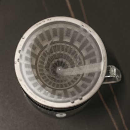 Paper filter being rinsed inside the TIMEMORE Vector dripper